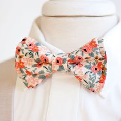 "Dapper Men's Rosa In Peach Bow Tie Made By The Belle And The Beau! ♥ Light creamy/peach background ♥ This beautiful cotton floral fabric is part of our New Collection of fabrics designed by Rifle Paper Co!  I've been a huge fan of Anna Bond (owner/designer of Rifle Paper Co) for years and have many of her things in my home. Needless to say, I was overjoyed when she introduced this gorgeous line of fabrics to her shop! We have been approved by Rifle Paper Co to make our products in these fabrics Peach Bow Tie, Bowties Men's, Anna Bond, Groomsmen Bowtie, Peach Background, Floral Bow Tie, Tie Men's, Dapper Men, Wedding Ties