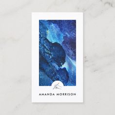 a blue and white marble business card with the words amanda morrison written in black on it