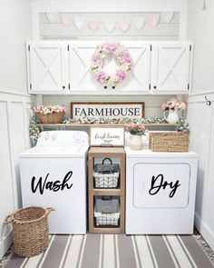 a white washer and dryer sitting in a laundry room