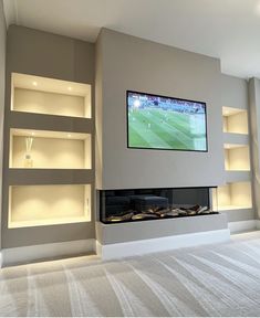 a flat screen tv mounted to the side of a wall above a fireplace in a living room