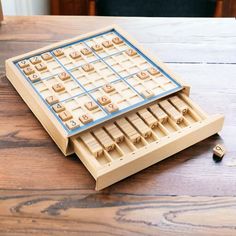 a wooden board game sitting on top of a table