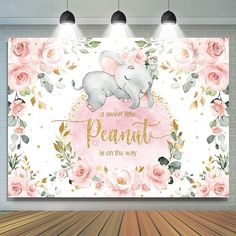 an elephant is sitting on top of a pink flowered wallpaper with the words, a sweet little peanut is on the way