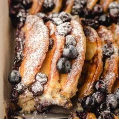 blueberry french toast in a box with powdered sugar