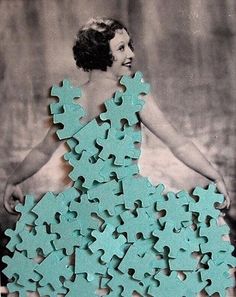 a woman in a dress made out of puzzles