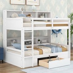 a white bunk bed with drawers underneath it