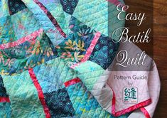 the easy batik quilt pattern guide is displayed on a wooden surface with text overlay that reads easy batik quilt