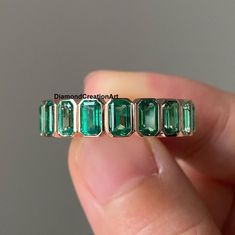 Emerald Eternity Band, Wedding Eternity Ring, 5x3mm Bezel Set Green Emerald Gemstone Band, May Birthstone Ring, Stackable Band, Gift For Her ✱ Specification ✱ Gemstone: ----------------------------- Type: Emerald Color: Green Shape: Emerald Cut Stone Size: 5x3 mm ✍This Listing's images are only for Imagin about this item. This is all our photography. If you place the order then the same item we can make it. ✍ This displayed all products are made with a highly polished shiny gold finished Jewelry Luxury Green Stackable Eternity Band, Emerald Eternity Band Stack, Anniversary Emerald Ring With Bezel Setting, Stackable Emerald Cut Emerald Ring For Anniversary, Stackable Emerald Cut Eternity Band For Anniversary, Emerald Cut Gemstone Eternity Band For Anniversary, Diamond Infinity Band, Eternity Band Stack, Emerald Eternity Band