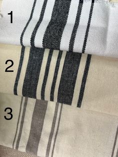 four different types of towels are shown with numbers on the bottom and one is black and white