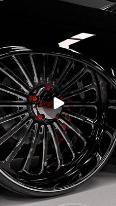 the wheels and rims of a black car