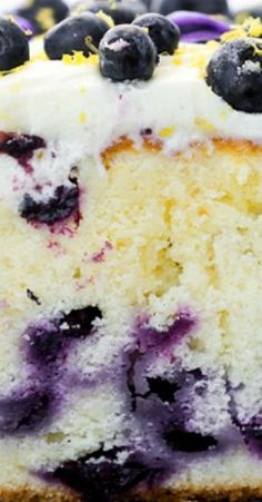 a close up of a cake with blueberries on it