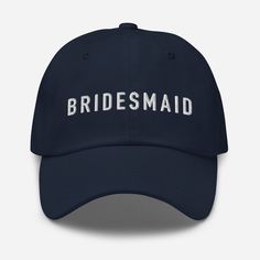 the bridesmaid hat in navy with white embroidered on it's front and back side