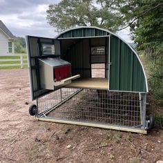 a chicken coop in the middle of a field