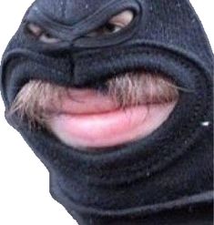 a man wearing a black mask with a moustache