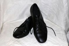 "Men's Vintage Very Fine Signature Dance Shoes by Dancesport. What a fashion for the ages! Material: Leather & Suede Colors: Black Size: 11 Measurements: Heel to Toe: 11.75 \" Heel Height: 1\" Ball Width: 4\" Condition: Gently Worn with some wear - see pictures Label: Very Fine Dancesport Shoes Signature 11" Fitted Lace-up Dance Shoes, Fitted Lace-up Dance Shoes With Leather Sole, Leather Round Toe Dance Shoes, Fitted Lace-up Dance Shoes With Rubber Sole, Casual Dance Shoes With Rubber Sole, Low-top Synthetic Dance Shoes With Rubber Sole, Fitted Synthetic Dance Shoes With Rubber Sole, Leather Lace-up Dance Shoes With Rubber Sole, Leather Pointed Toe Dance Shoes