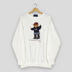 Vintage 90's Polo Bear Ralph Lauren White Sweatshirt Medium Polo By Ralph Lauren Sweater Polo Bear Ralph Lauren Winter Crewneck Size M Good Used Condition. No holes and stains. Size (On Tag) : Size M **To make sure if it FITS YOU, refer at the exact measurements. Size Measurement (All measurements were taken lying flat) : Width [armpit to armpit] : 22 inches / 56 cm Length [shoulder to end of garment] : 27.5 inches / 70 cm THIS IS USED CLOTHING! PLEASE DON`T EXPECTED IT TO BE LIKE NEW OR DON`T E Ralph Lauren Winter, Polo Bear Ralph Lauren, Winter Crewneck, Sweater Polo, Ralph Lauren Menswear, Ralph Lauren Sweatshirt, Ralph Lauren Pullover, Polo Bear, Lauren White