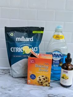 ingredients for baking cookies sitting on a marble counter top next to a bag of flour