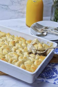 a white dish filled with food on top of a table