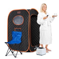 a woman standing next to a portable shower