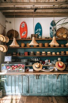 hats and surfboards are hanging above the counter