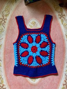 Holy crap this is amazing and special 1970's handmade crocheted tank top Blue, light blue and red colors Great pattern and design Tank sleeves and scoop down pretty low so your bra will definitely hang out That doesn't bother me but it may to some so it's to be noted It's in amazing condition Fits a medium/smaller large there is a little stretch to the yarn Measurements are approximate and taken flat so please double bust and waist for more accurate sizing Bust: 17.5 in Waist: 16 in Length: 24.5 Vintage 70s, Blue Light, Hanging Out, Red Color, Crochet Blanket, Tank Tops Women, 1970s, Hand Made, Light Blue