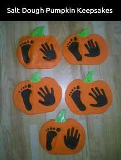 some fake pumpkins with hand prints on them