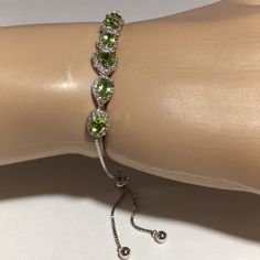 Bracelet Is In Excellent Condition. 3.88 Ctw Peridot And 1.48 Ctw White Zircon Stones. Rhodium Over Sterling Silver (Prevents Tarnish) Bolo Bracelet. Beautiful Sparkly Stones. Elegant Silver Peridot Bracelets, Green Sterling Silver Jubilee Bracelet, Sterling Silver Bracelet With Green Gemstone, Elegant Adjustable Green Tennis Bracelet, Elegant Green Adjustable Tennis Bracelet, Adjustable Elegant Lime Green Jewelry, Bolo Bracelet, Jtv Jewelry, Green Stone