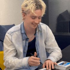 a person sitting at a table with a laptop