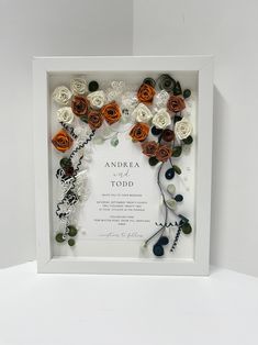 there is a white frame with flowers and leaves on the inside that says anorea to god