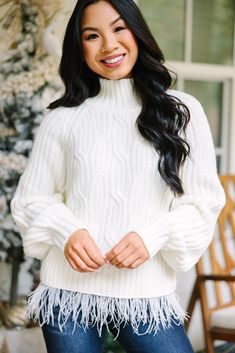 This sweater is so cute! We are obsessed with that feather trim! It's so sassy and fun! This mock neck sweater is going perfectly dress up a classic pair of jeans but will also look fab with a skirt. Mock neckline Long bubble sleeves Cable knit fabric Feather trim Fair stretch Cindy is wearing the small. Fabric Feather, Fabric Feathers, White Feather, Feather Trim, Mint Julep Boutique, White Feathers, Mock Neckline, Model Fits, Mock Neck Sweater