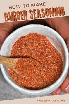 a person holding a white bowl filled with red seasoning