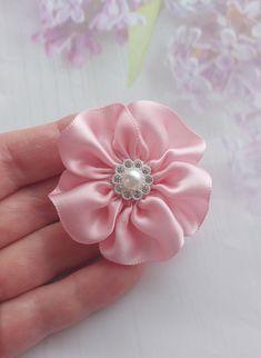 Pink Satin ribbon  badge brooch with rhinestone pearl centre Measures 5 cm/ 2 inch approx. Listing is for 1 x brooch Beautiful handmade flower brooch Elegant Rosette Brooches For Party, Silver Brooch With Ribbon For Gifts, Silver Wedding Brooch With Ribbon, Elegant Rosette Wedding Brooches, Elegant Rosette Brooches As A Gift, Elegant Pink Flower Pins, Elegant Pink Wedding Lapel Pin, Elegant Handmade Flower Pins For Gifts, Elegant Handmade Flower Pins As Gift