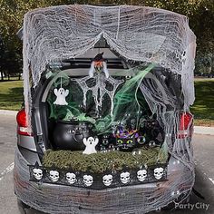 the trunk of a car decorated with halloween decorations