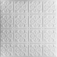 a white ceiling tile with an intricate design on the front and back panel, which has been