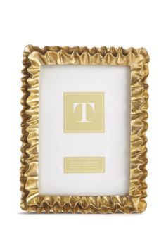 a gold frame with the letter t on it