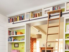 there is a ladder in the room with books on it