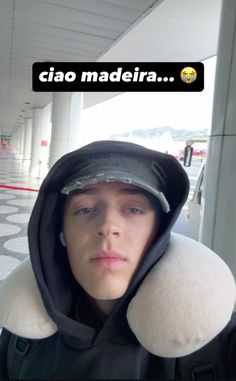 a man wearing a hoodie with the caption ciao madeira