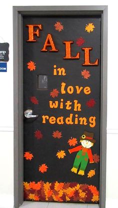 a door decorated with fall leaves and the words fall in love with reading