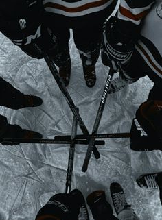 a group of hockey players standing in a circle