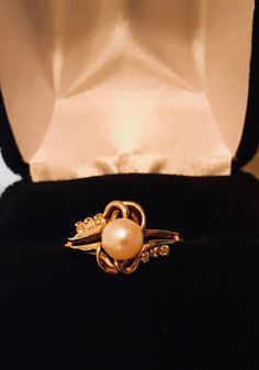 14K YELLOW GOLD, Vintage, Pearl, Diamonds, Statement Ring, Beautiful Gemstones, Fine Jewelry, Gorgeous Art Nouveau Design, Ring Size 8.25, Weight 3.1 g. Great Gift For her, Birthday Gift, Christmas Gift. Anniversary Gift. Photo image is magnified x 10. Comes in Black Velvet Box. Gold Gemstone Jewelry For Anniversary, Gold 14k Hallmarked Pearl Ring, Gold Pearl Ring Stamped 14k For Gift, Formal Yellow Gold Jewelry With Birthstone, Formal Yellow Gold Birthstone Jewelry, Gold Birthstone Ring With Cubic Zirconia, Classic Gold Diamond Ring With Gemstone, Exquisite Pearl Ring For Anniversary, Luxury Gold Diamond Ring With Birthstone