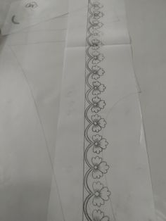 two pieces of paper with designs on them