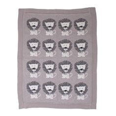 a gray blanket with lions on it