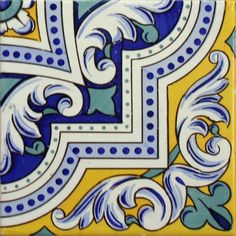 an artistic tile with blue and yellow designs