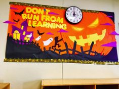 a clock on the wall above a bulletin board that says don't run from learning