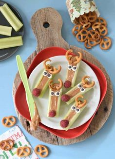 some pretzels are sitting on a plate with googly eyes