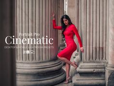 a beautiful woman in a red dress leaning against pillars with her hand on the pillar