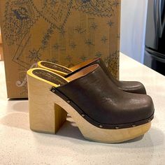 Slip-On Style, Leather Uppers, Wooden Platform Sole, Chunky Block Heel, Square Toe, Lined Footbed, Stud Details Leather, Wood **All Items Come From Smoke And Pet Free Environment** Free People Clogs, Platform Clogs, Free People Shoes, Chunky Block Heels, Mule Clogs, Mules Shoes, Me Too Shoes, New Color, Block Heels