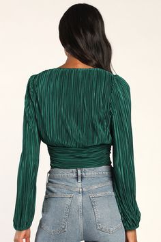 You'll always be outshining the competition in the Lulus Gorgeous Glamour Emerald Green Plisse Satin Long Sleeve Top! Sleek woven plisse satin shapes long balloon sleeves (with elastic at the cuffs) that frame a flattering bodice with a V-neckline and a wide hem that features an adjustable ruched detail at the center. Hidden zipper at side. Fit: This garment fits true to size. Length: Size medium measures 18" from shoulder to hem. Bust: Great for any cup size. Waist: Fitted - very fitted at natu Pleated Sleeve Tops For Fall Party, Fall Party Tops With Pleated Sleeves, Pleated Long Sleeve Tops For Party, Long Sleeve Tops With Pleated Sleeves For Party, Fitted Satin Tops With Blouson Sleeves, Fitted Top With Pleated Sleeves For Party, Fitted Tops With Pleated Sleeves For Party, Green Long Sleeve Holiday Top, Fitted Pleated Blouse For Party