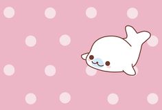 a cute little narw laying on top of a pink background with white polka dots