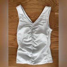 Nwt Livi Silver Shimmering Tank Top Blouse Size Xs V Cut Front And Back Rushing Down The Middle Fitted To Body Polyester/Lirex/Spandex Material Fitted Cotton V-neck Tank Top, Fitted V-neck Top For Workout, Tank Top Blouse, V Cut, V Cuts, The Middle, Top Blouse, Tank Top, Womens Tops