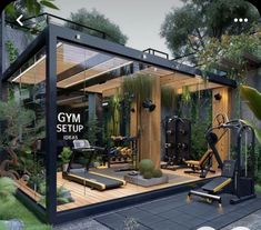 an image of a gym setup in the middle of a yard with trees and plants